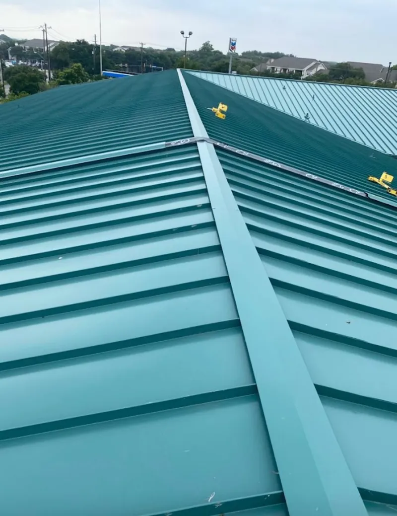 Green commercial metal roof ridge and valley for Metal Roof Repair in Bay St. Louis